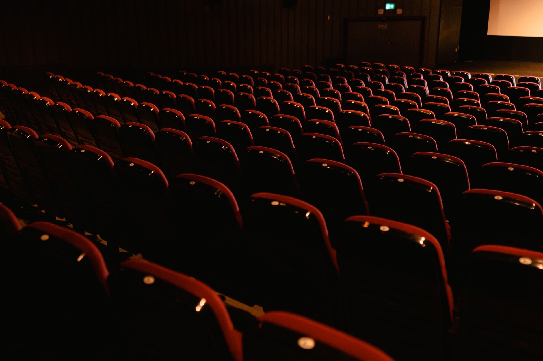 cinema screen light glow dark empty seats