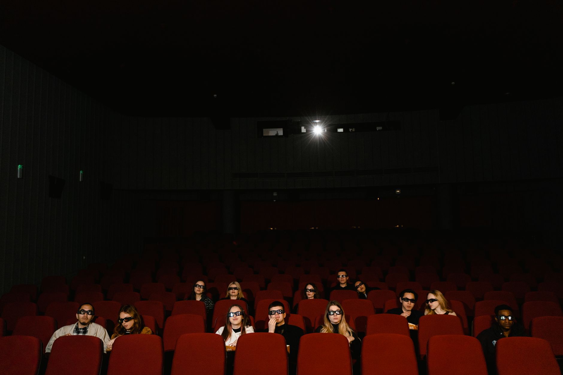 cinema theater hall dark seats with screen glow