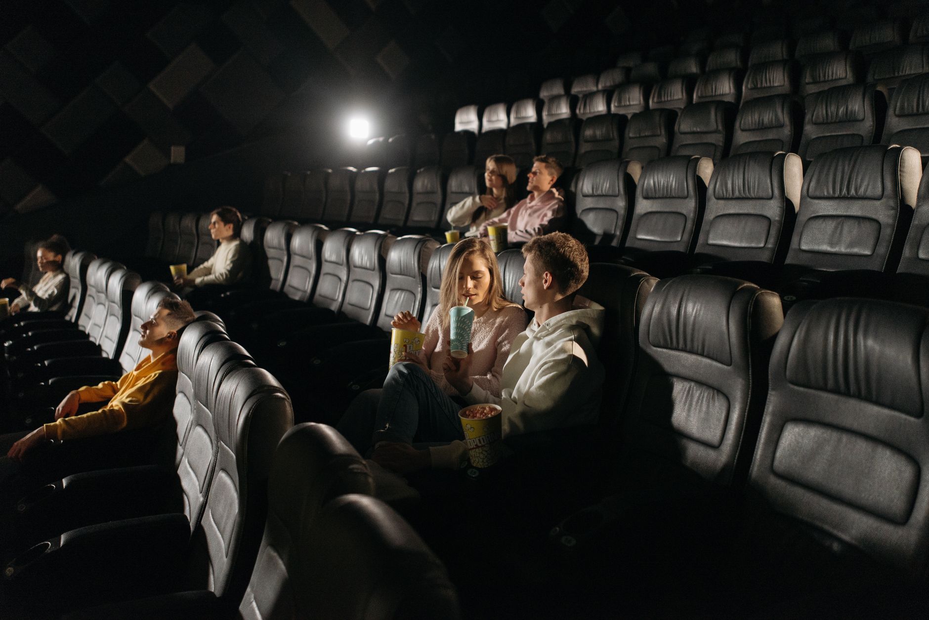 cinema theater hall dark seats with screen glow