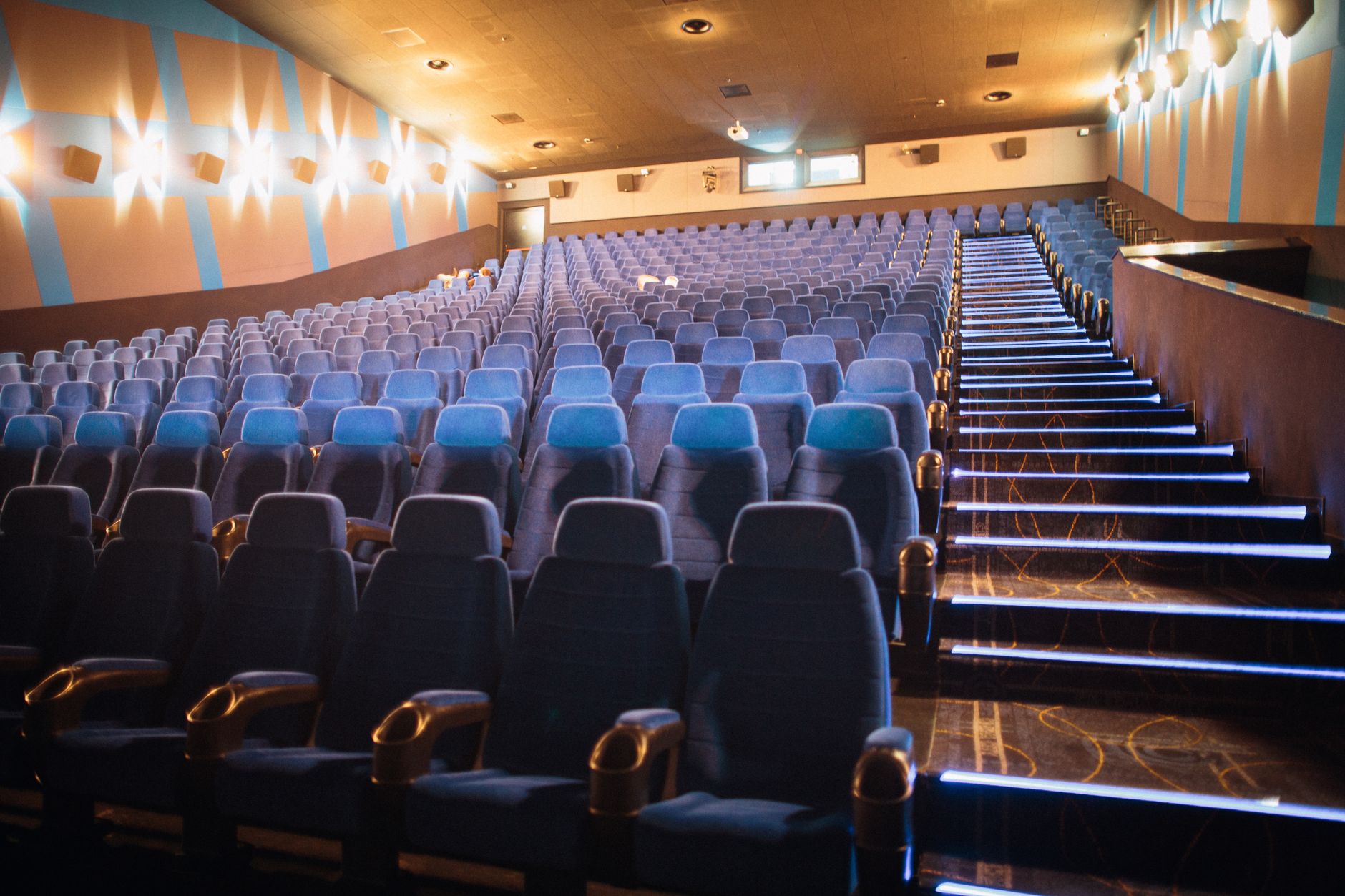 cinema theater hall dark seats with screen glow
