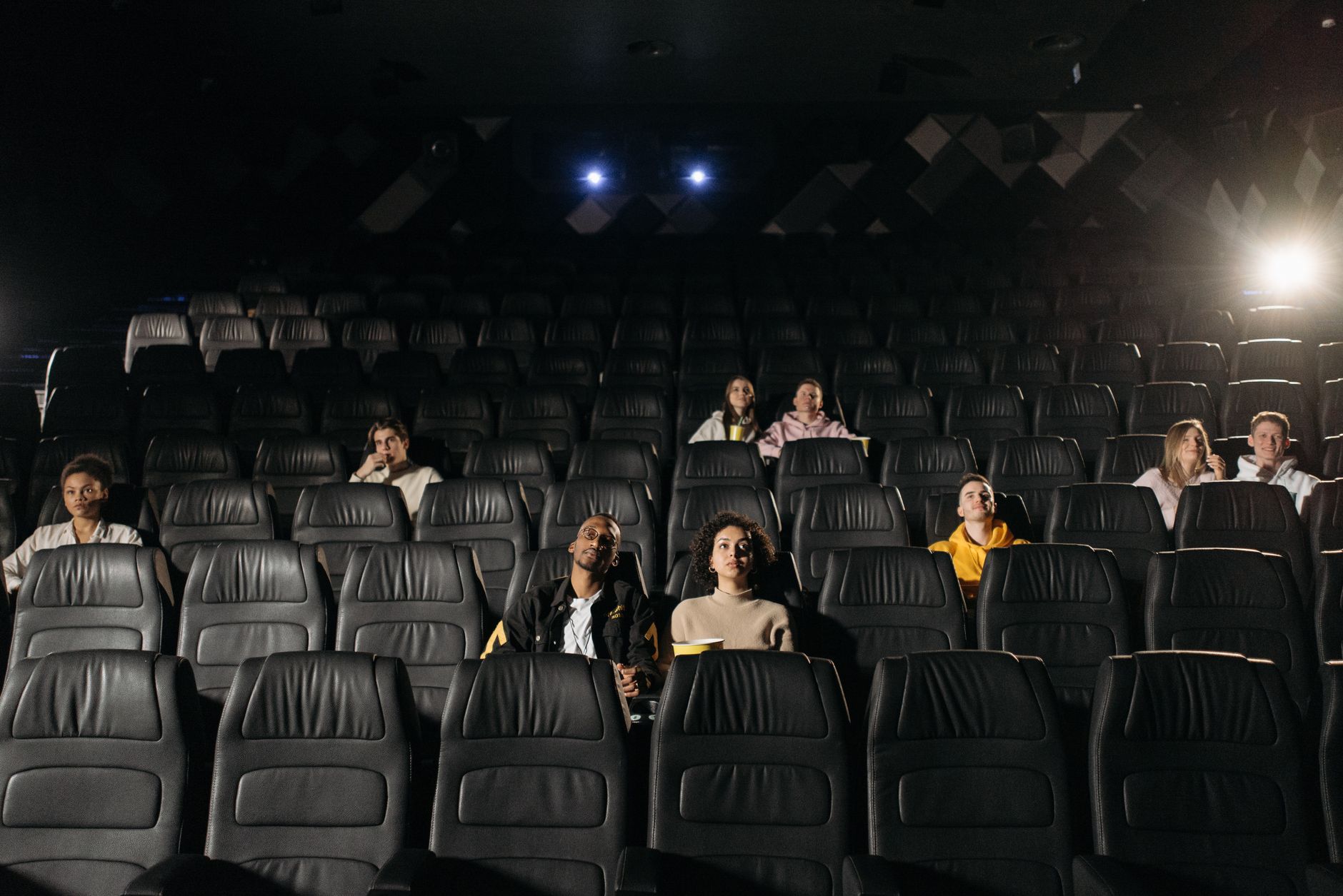 cinema theater hall dark seats with screen glow