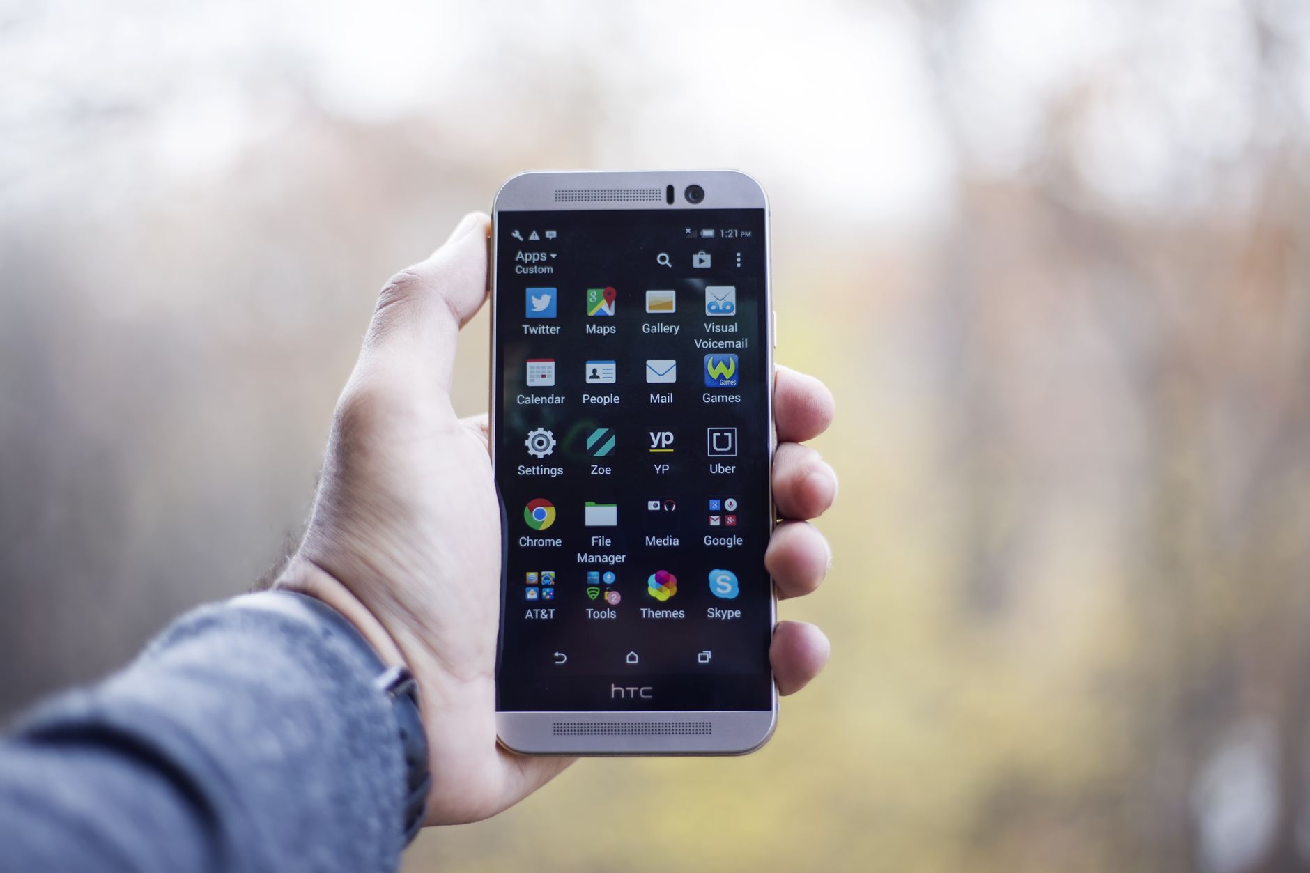 person holding smartphone with glowing network icons