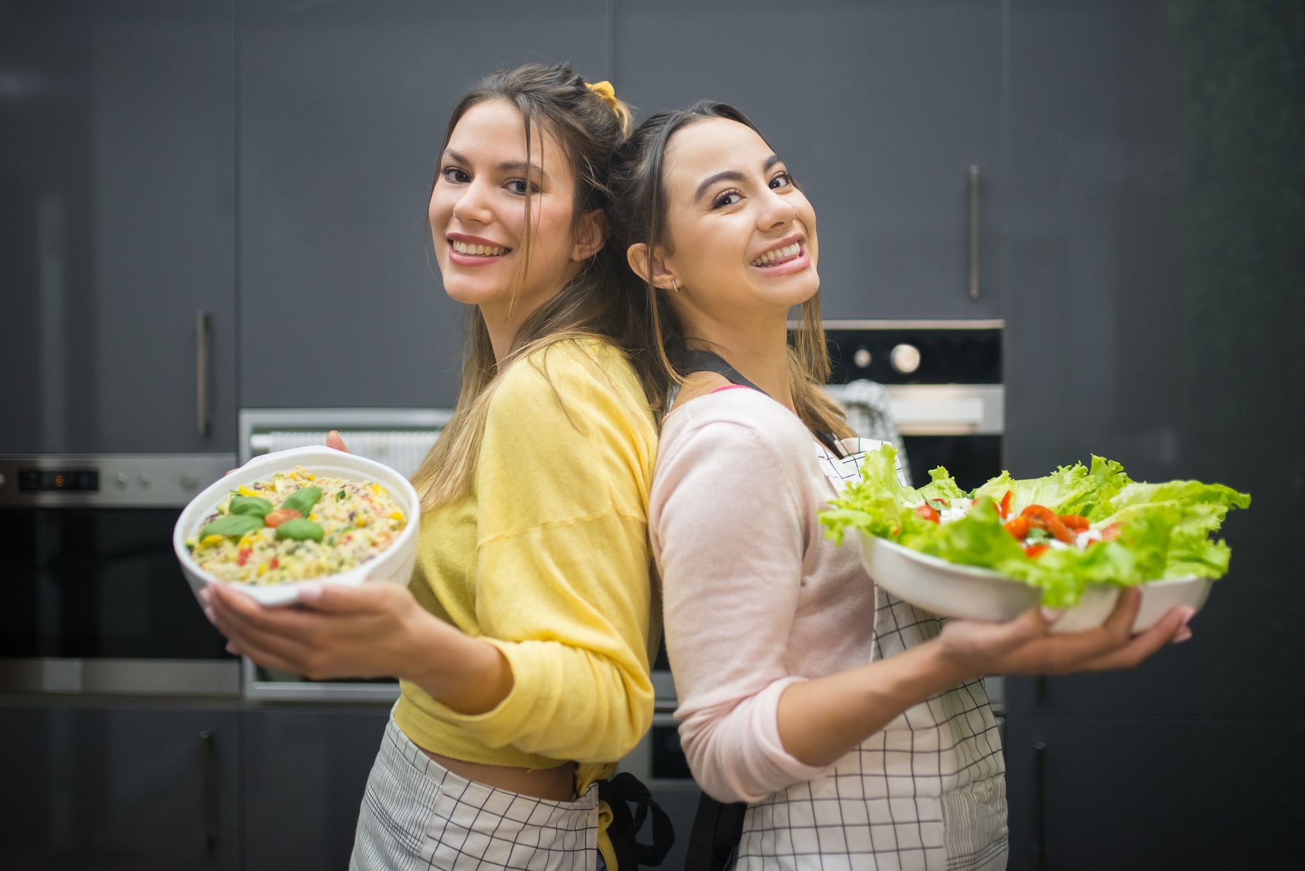 young woman preparing healthy colorful meal bowl kitchen