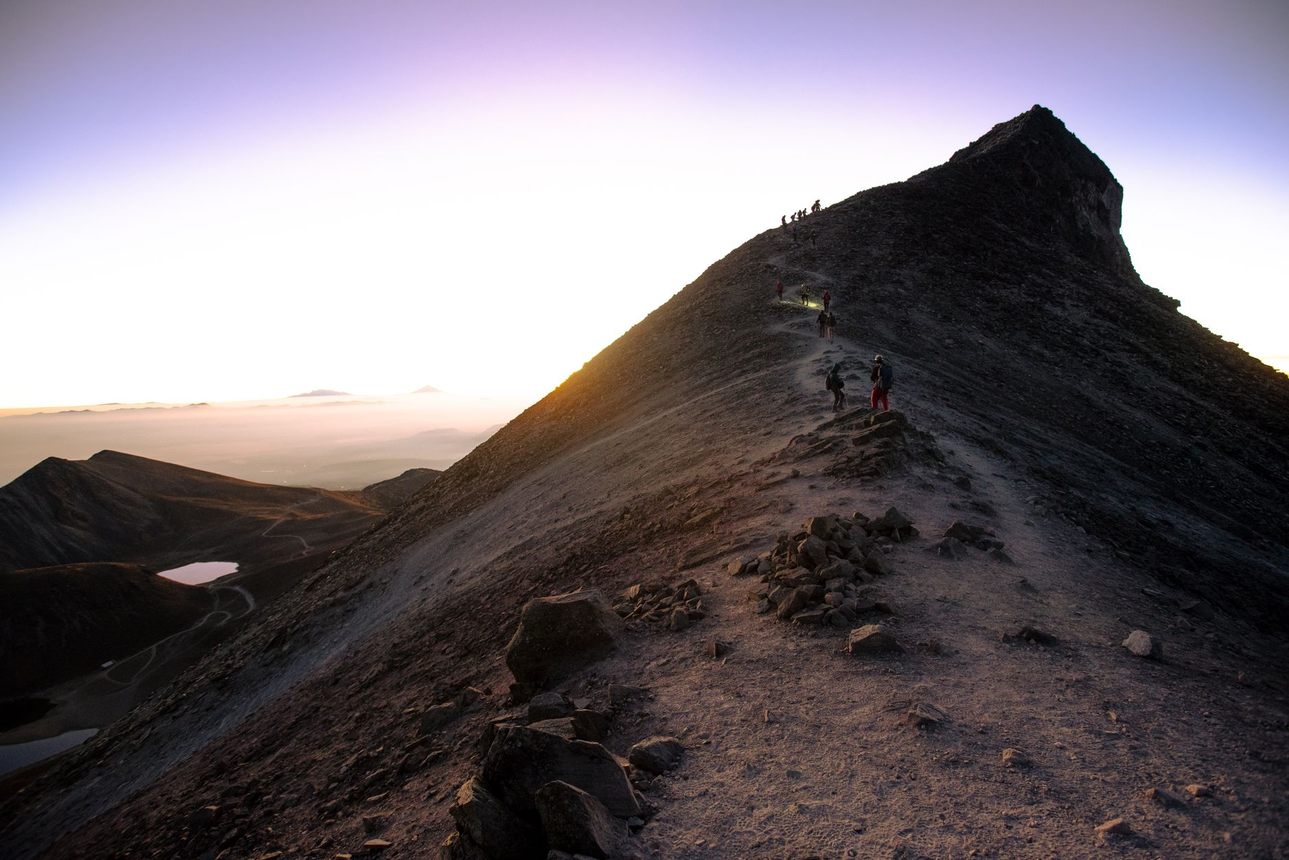 trail runner ascending mountain path sunrise