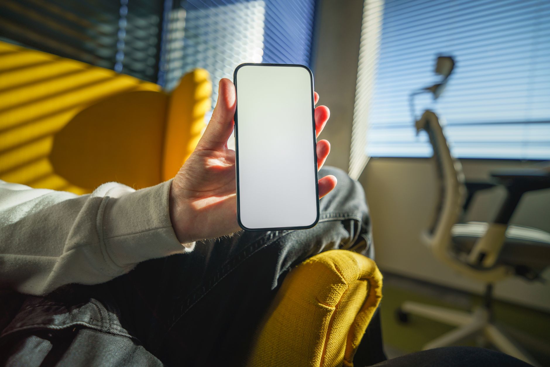 woman holding smartphone showing medical app screen