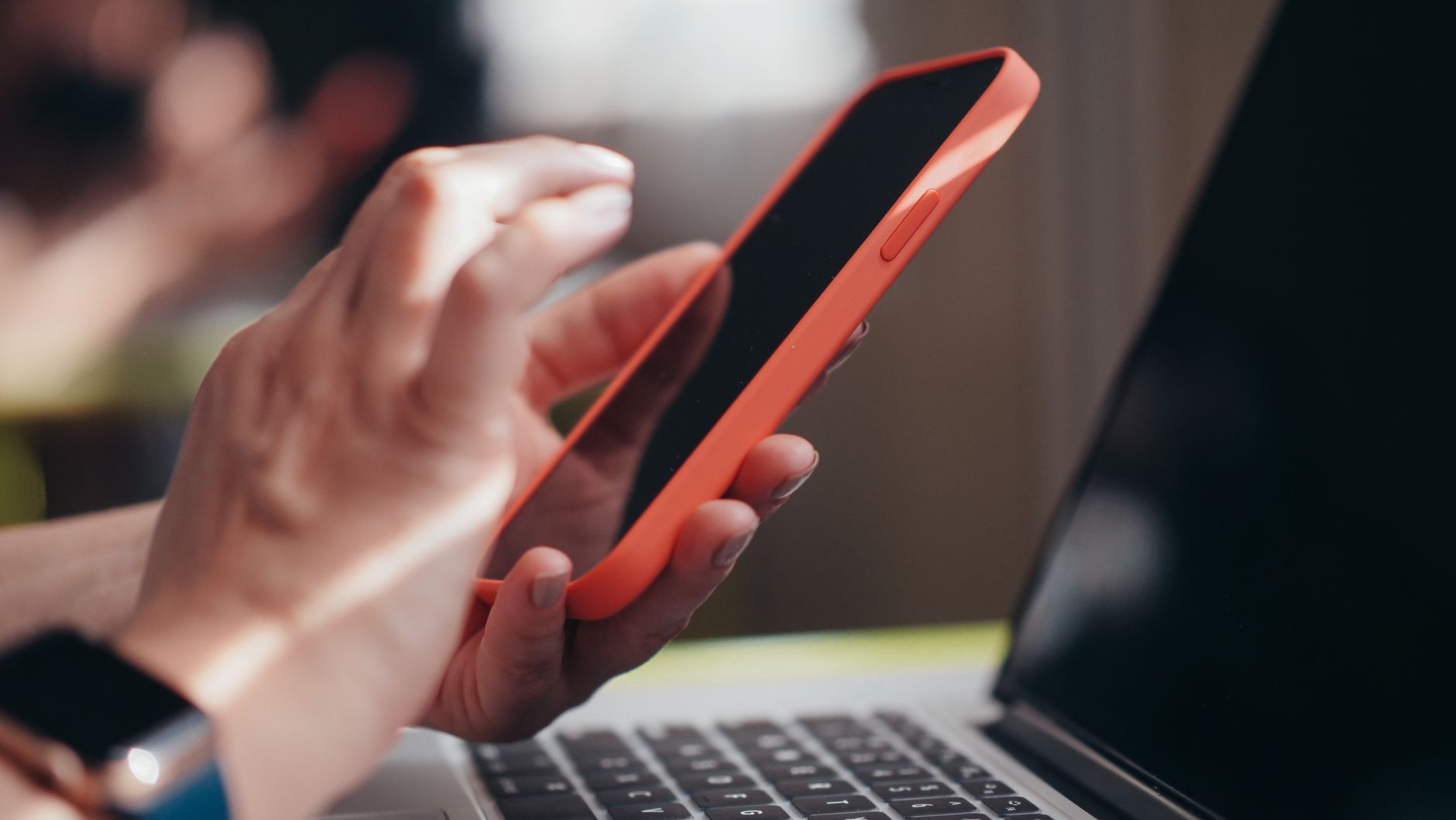 hand holding smartphone checking electricity bill online