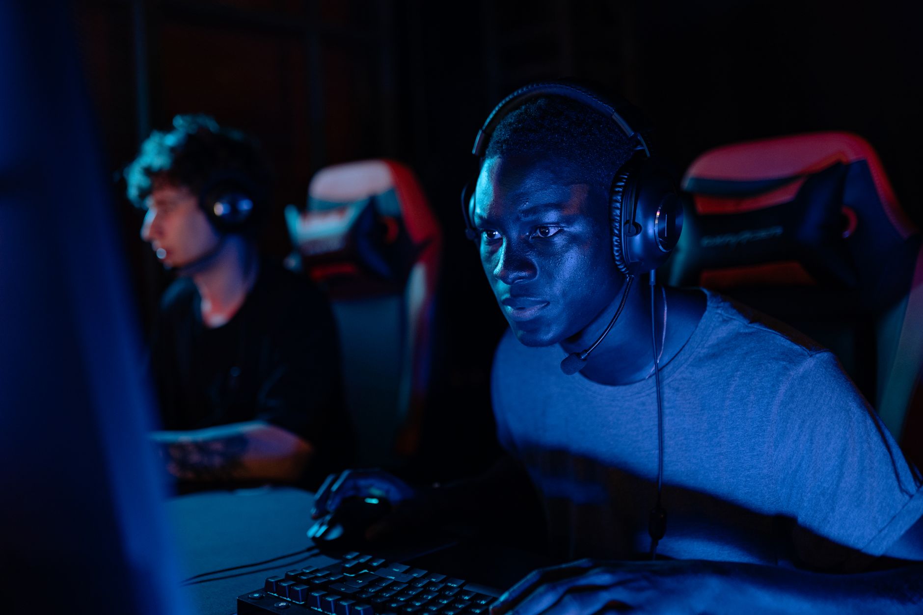 person wearing headset focused on screen