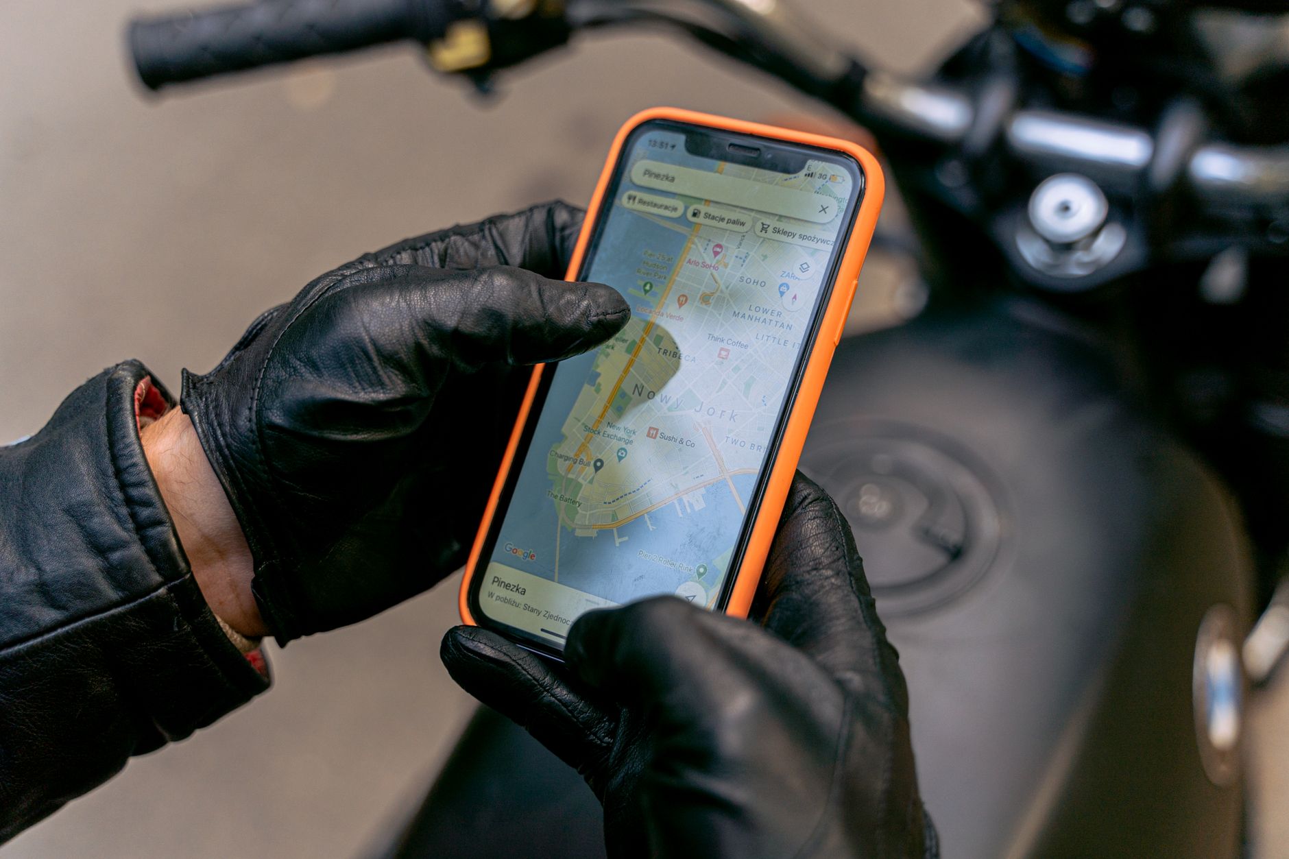 hand holding smartphone with navigation app map