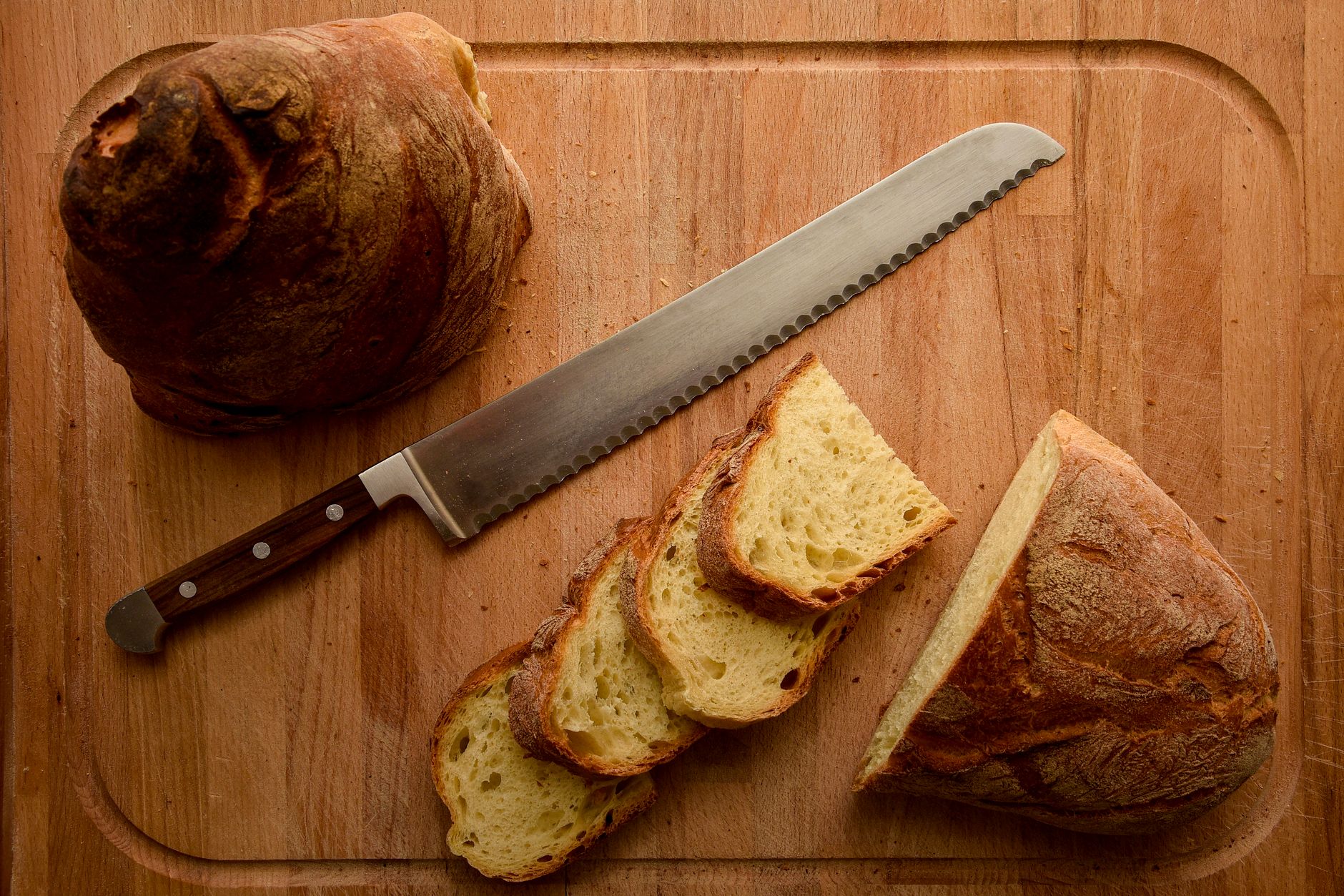 rustic sourdough bread slices on wooden board
