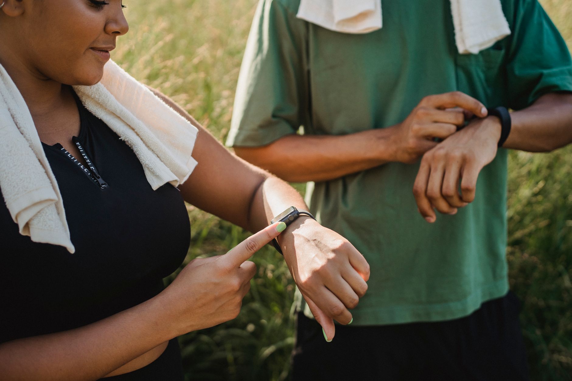 athlete checking smartwatch during morning run