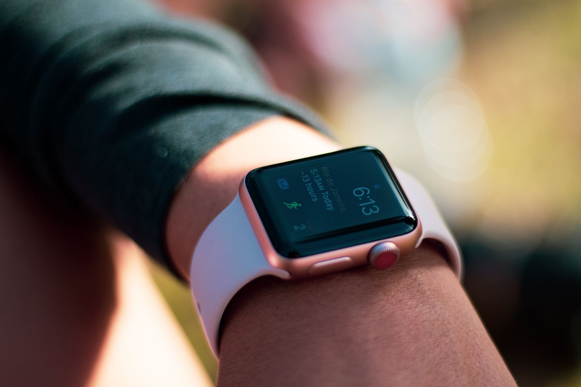 person jogging with smartwatch on wrist