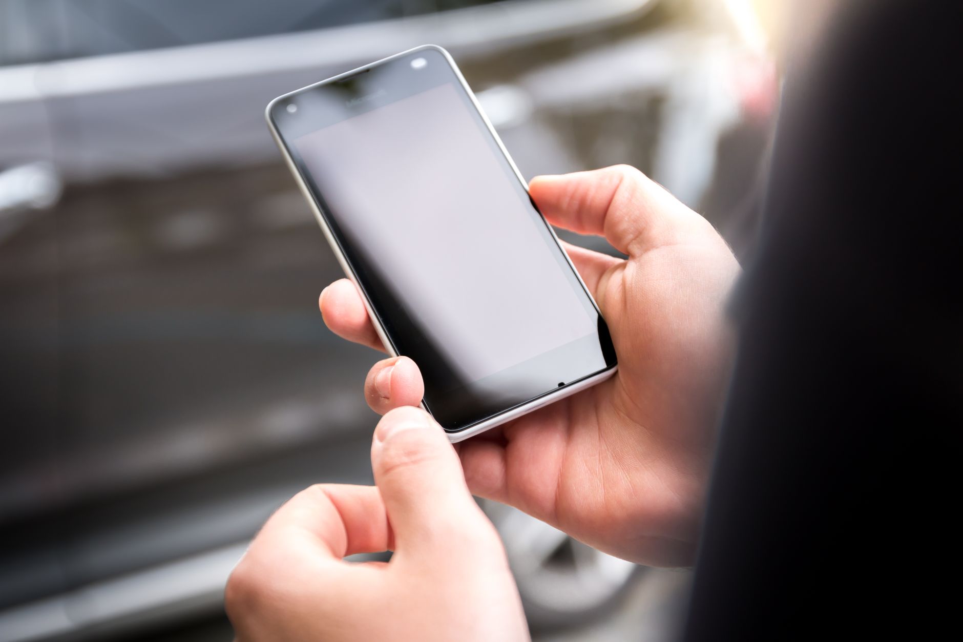 hand holding smartphone checking data usage