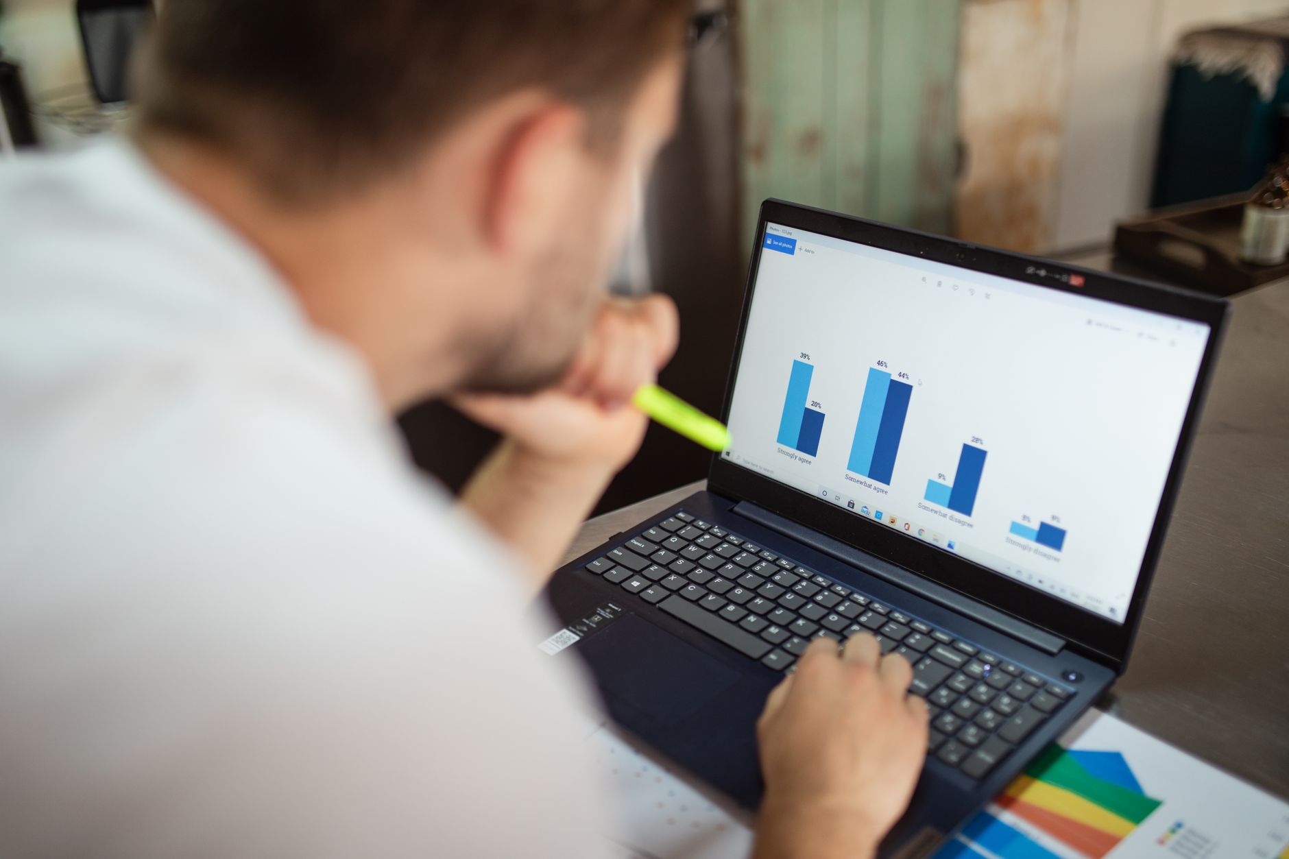 businessman reviewing financial charts laptop