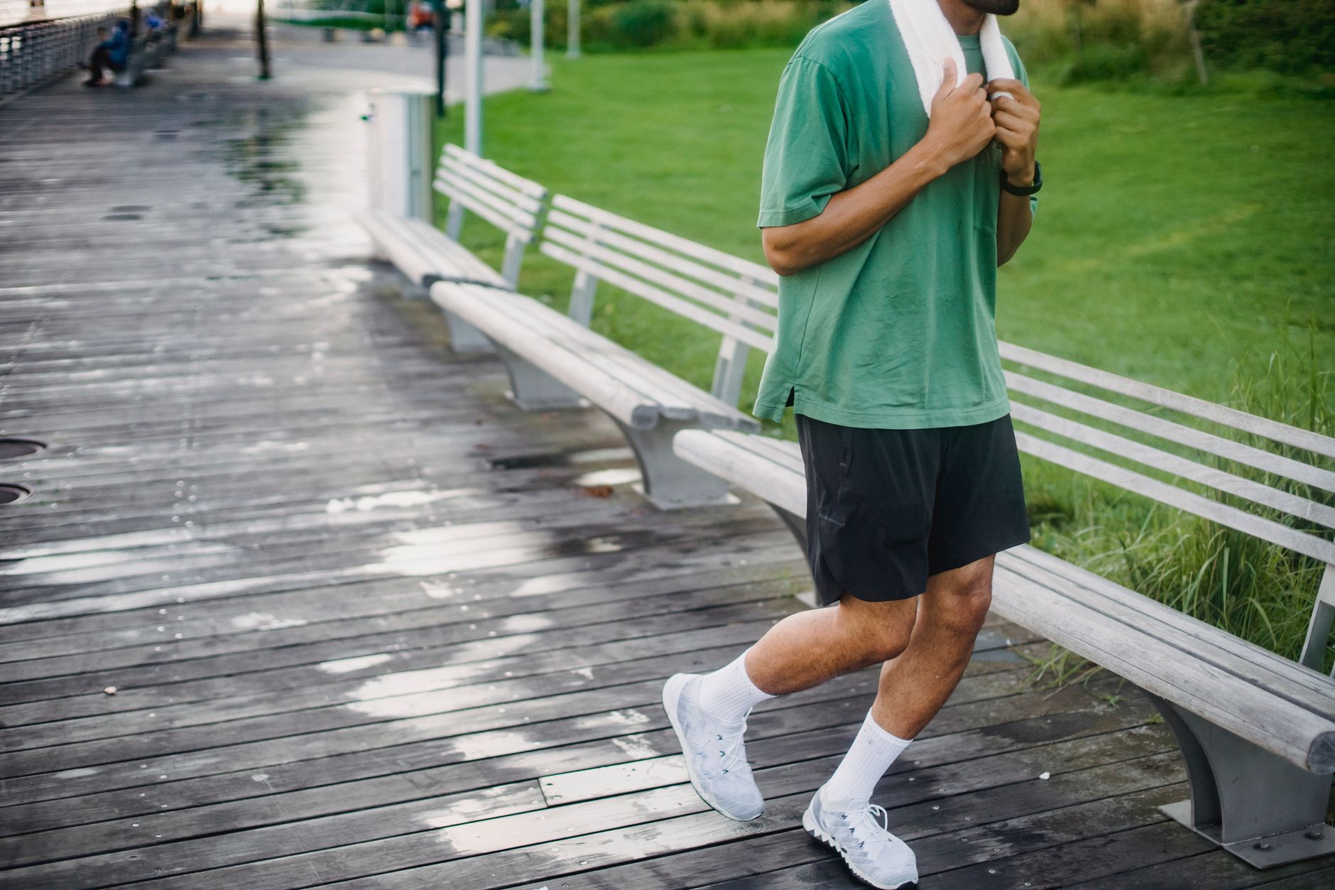 person jogging in green park early morning