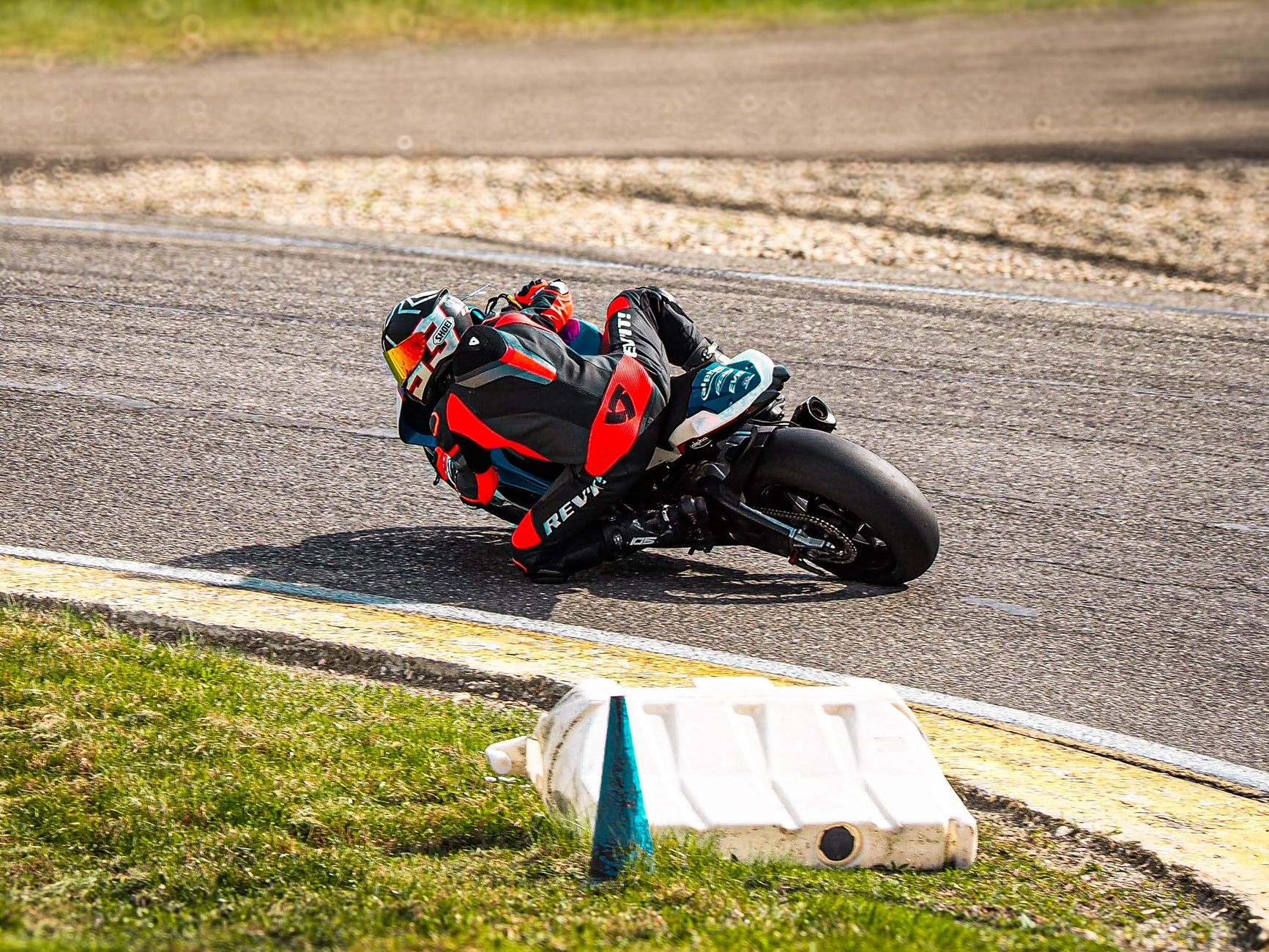 motorcycle racer speeding on track close-up