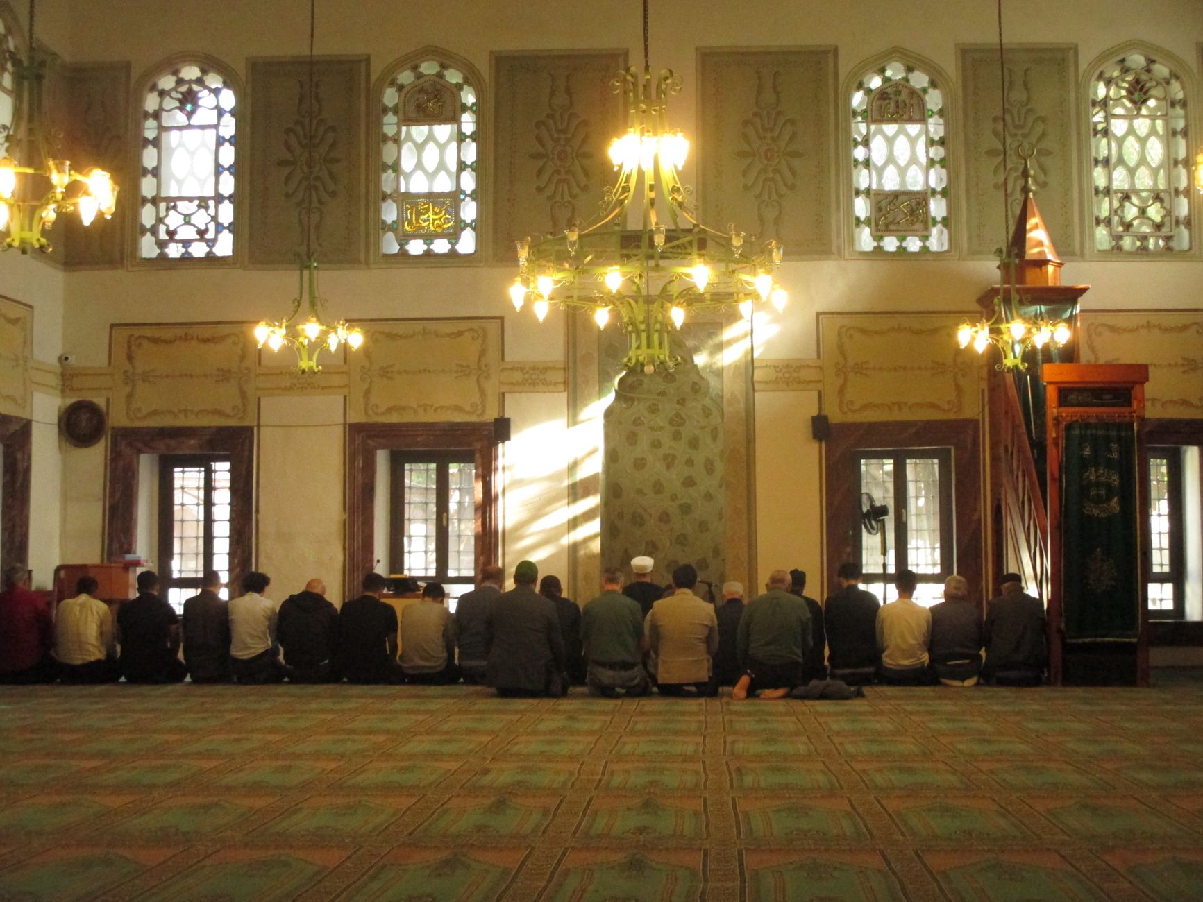 mosque interior prayer rug sunlight entering window