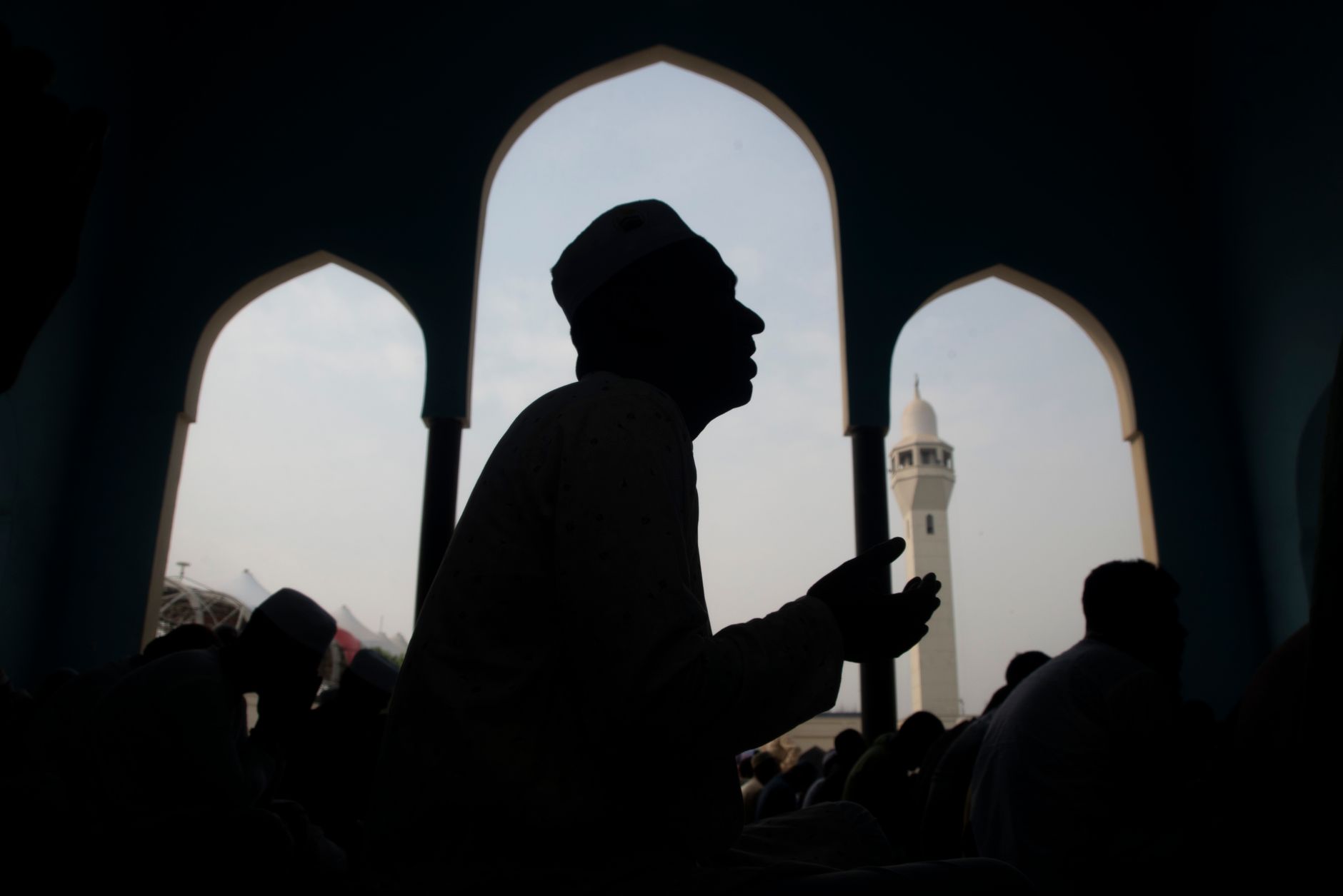 muslim man praying at dawn silhouette
