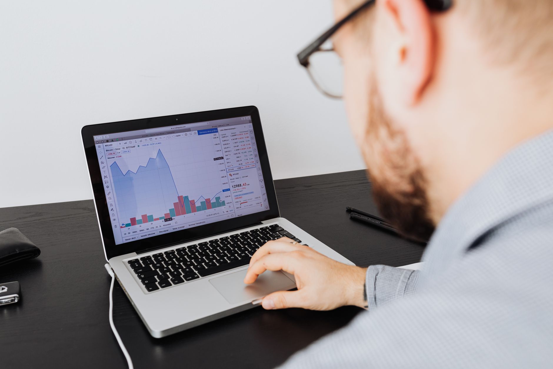 meteorologist analyzing weather data on laptop