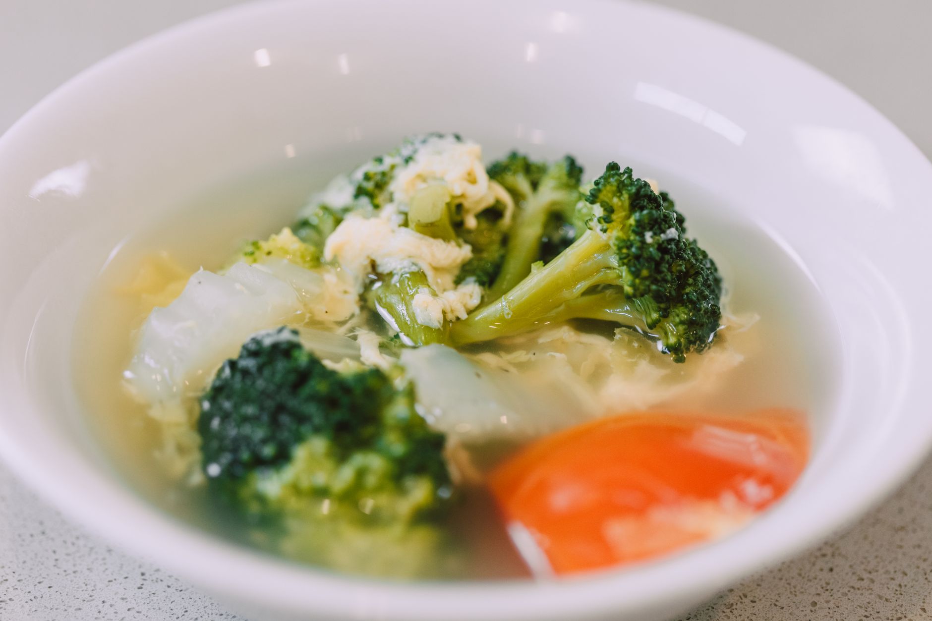 healthy steamed vegetables bowl on wooden table