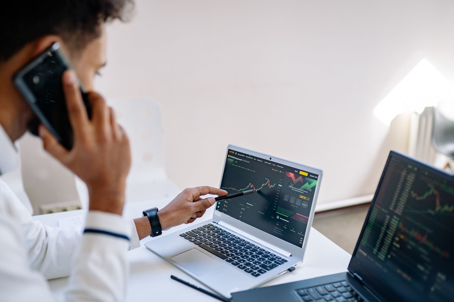 businessman reviewing financial charts laptop modern office