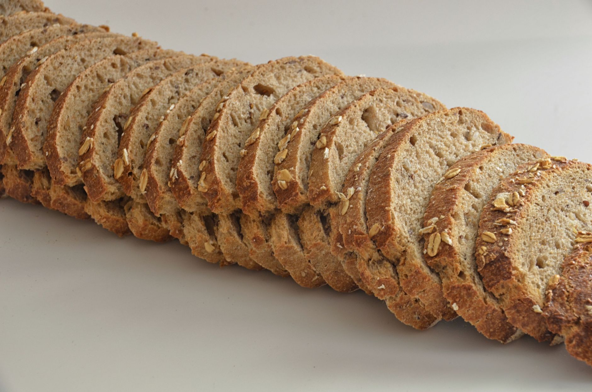 healthy whole grain bread slices kitchen counter