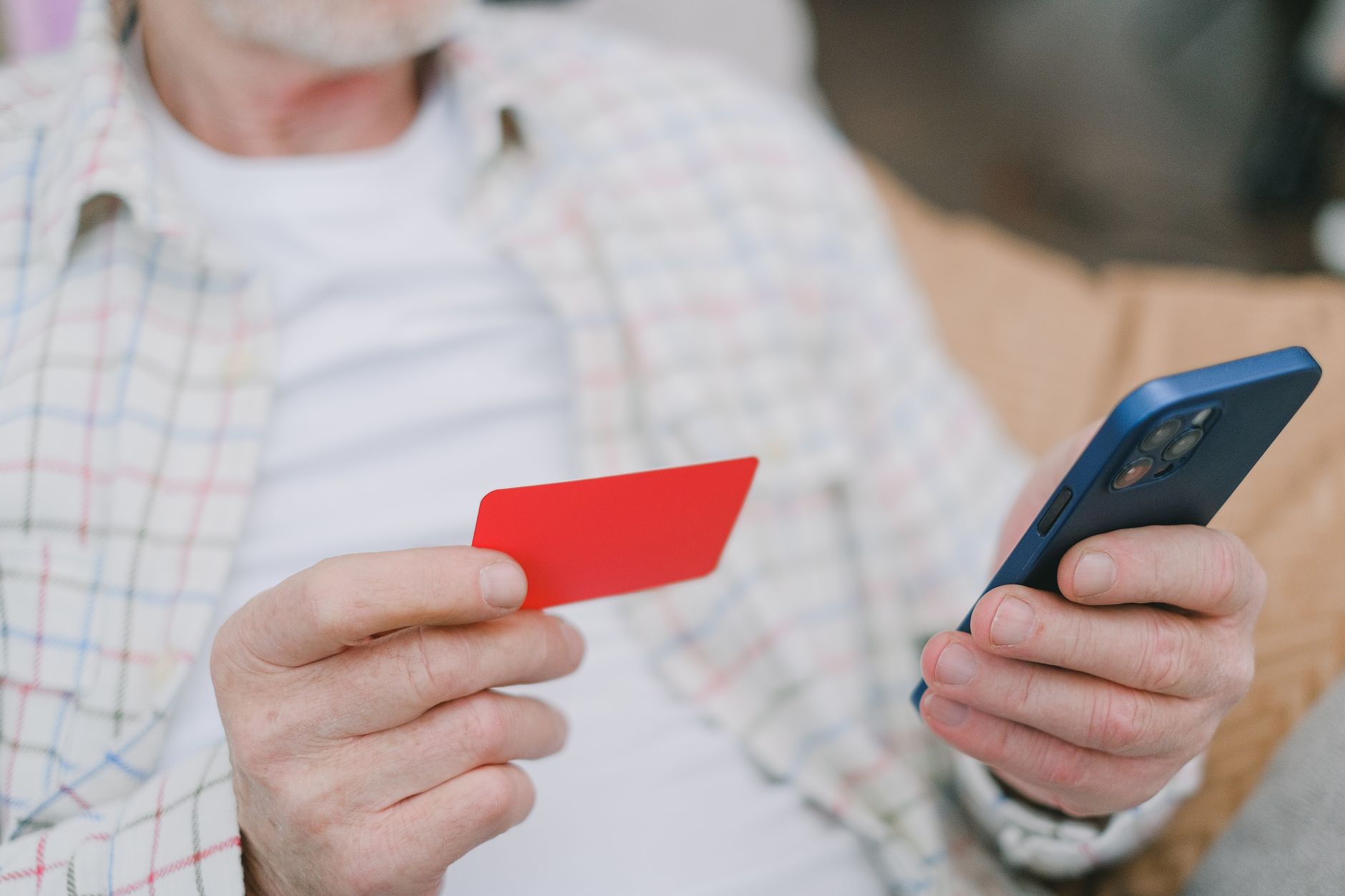 hand holding smartphone paying electricity bill online