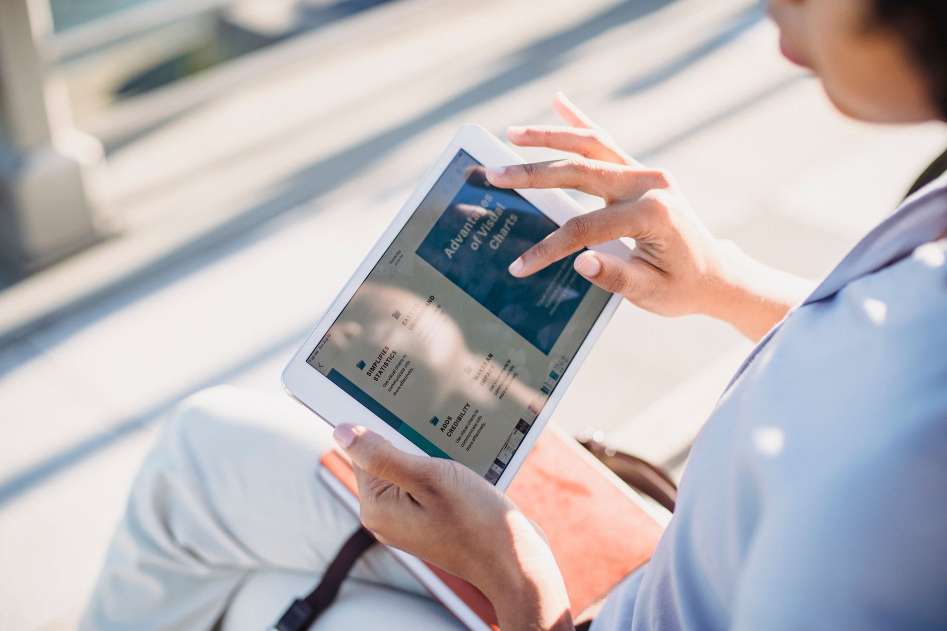 hands holding tablet browsing government website