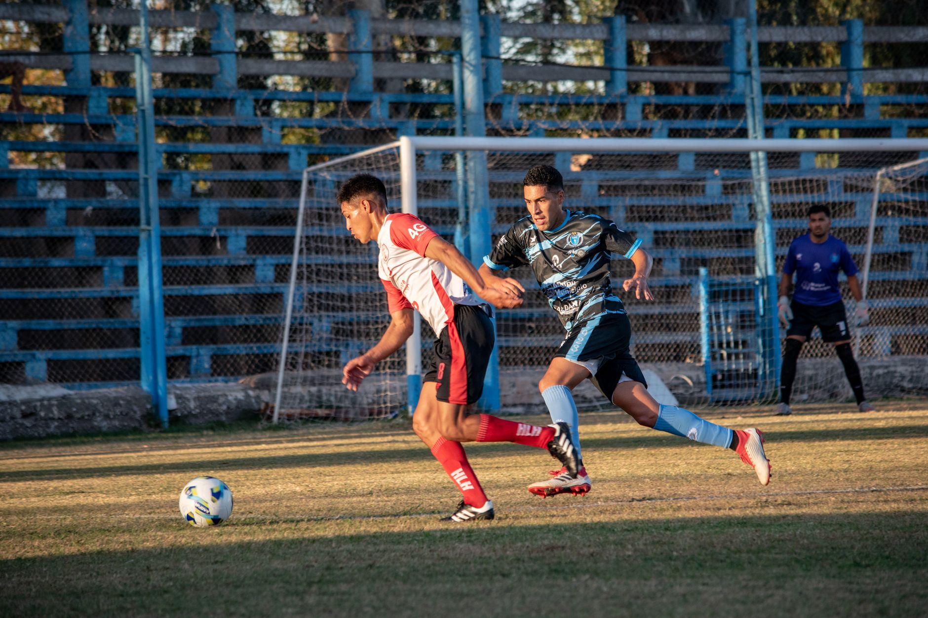 football players competing for ball on field