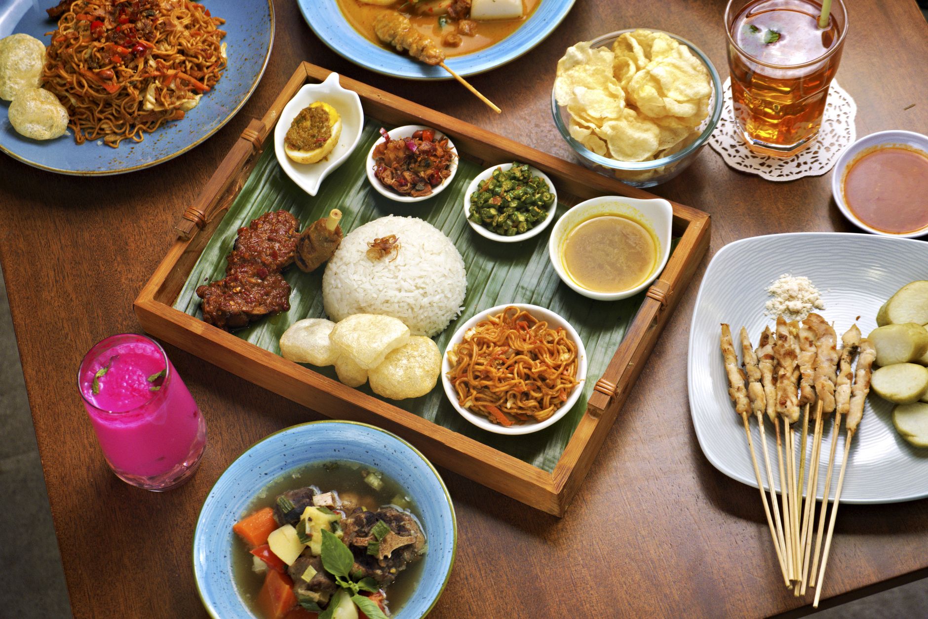 various traditional Indonesian warteg dishes on table