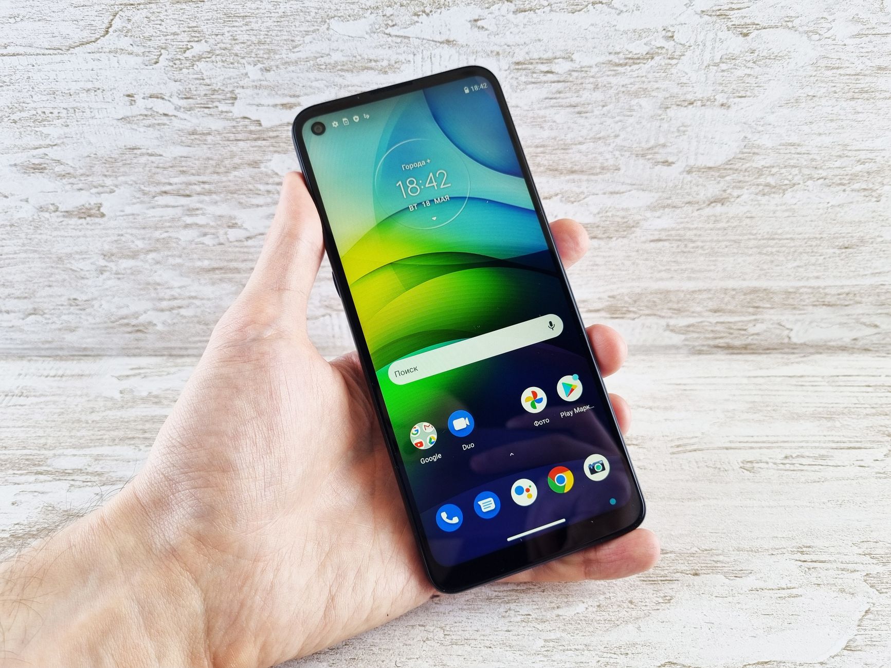 hand holding android phone with bright screen