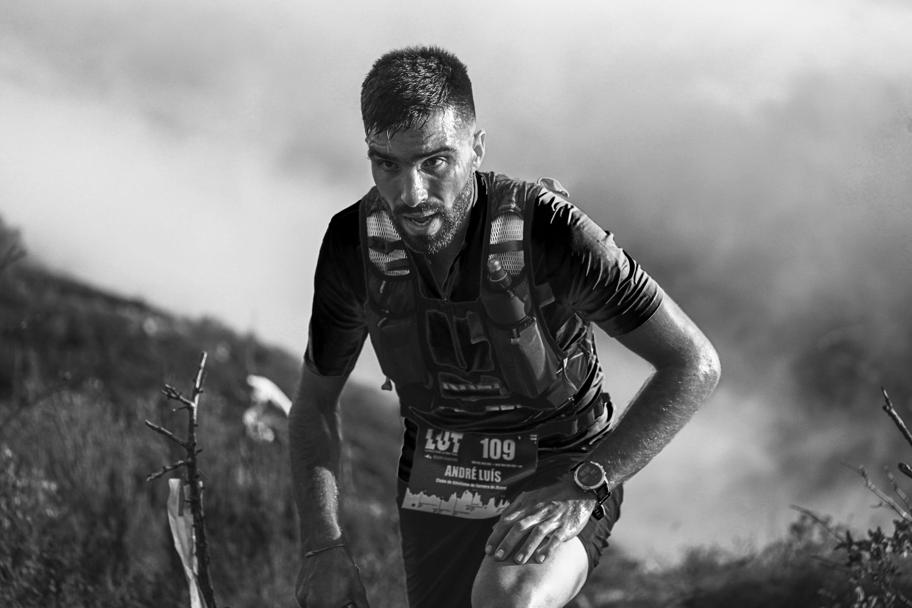 trail runner ascending mountain path sunrise