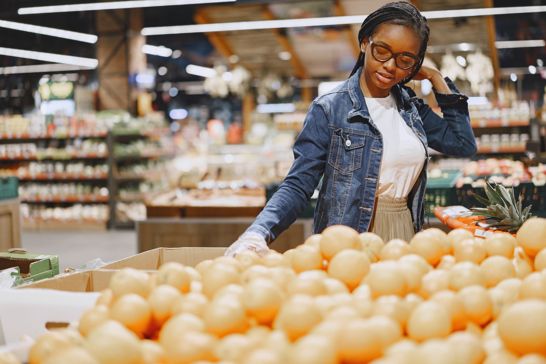 woman choosing bread in supermarket aisle healthy