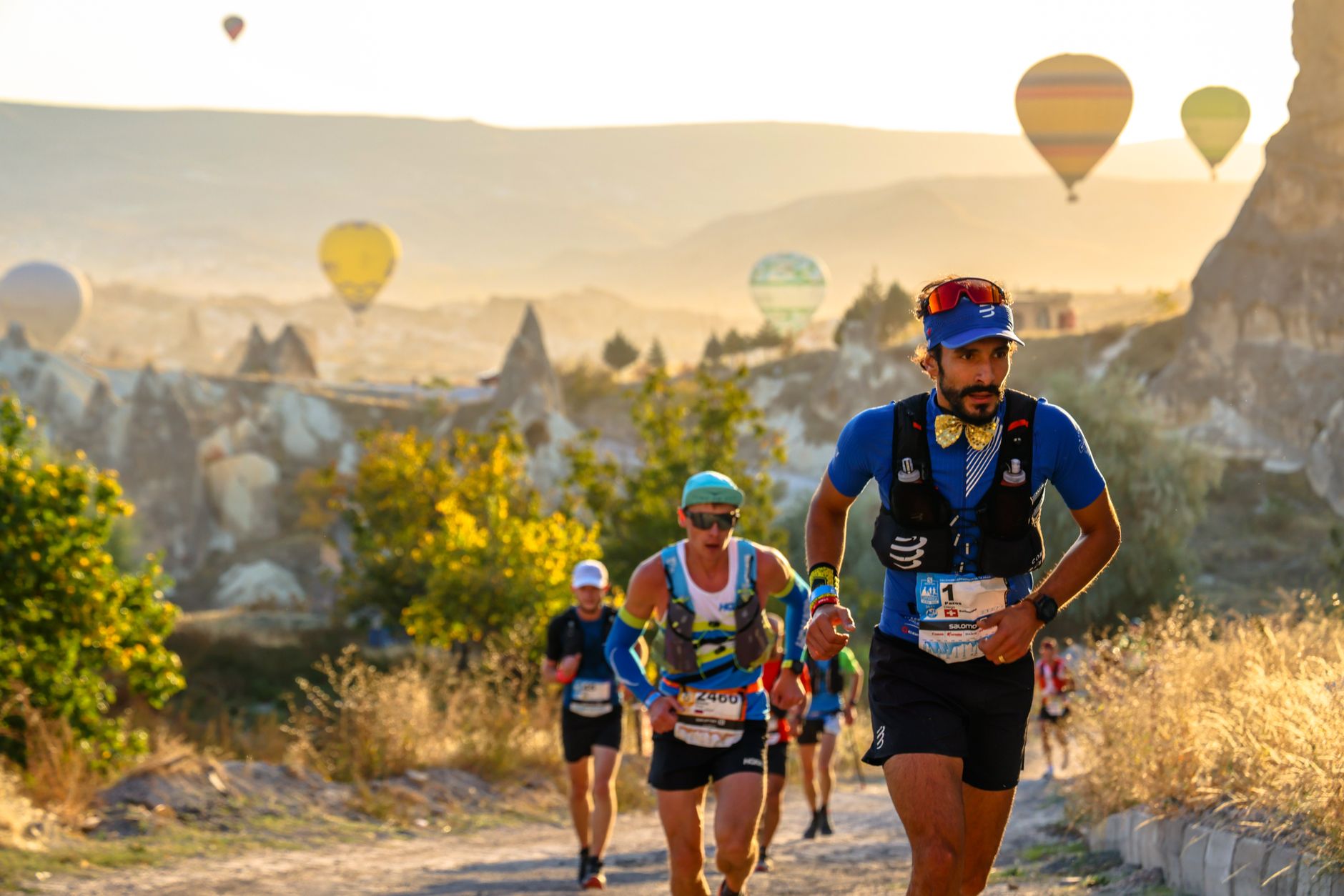 trail runner ascending mountain path sunrise