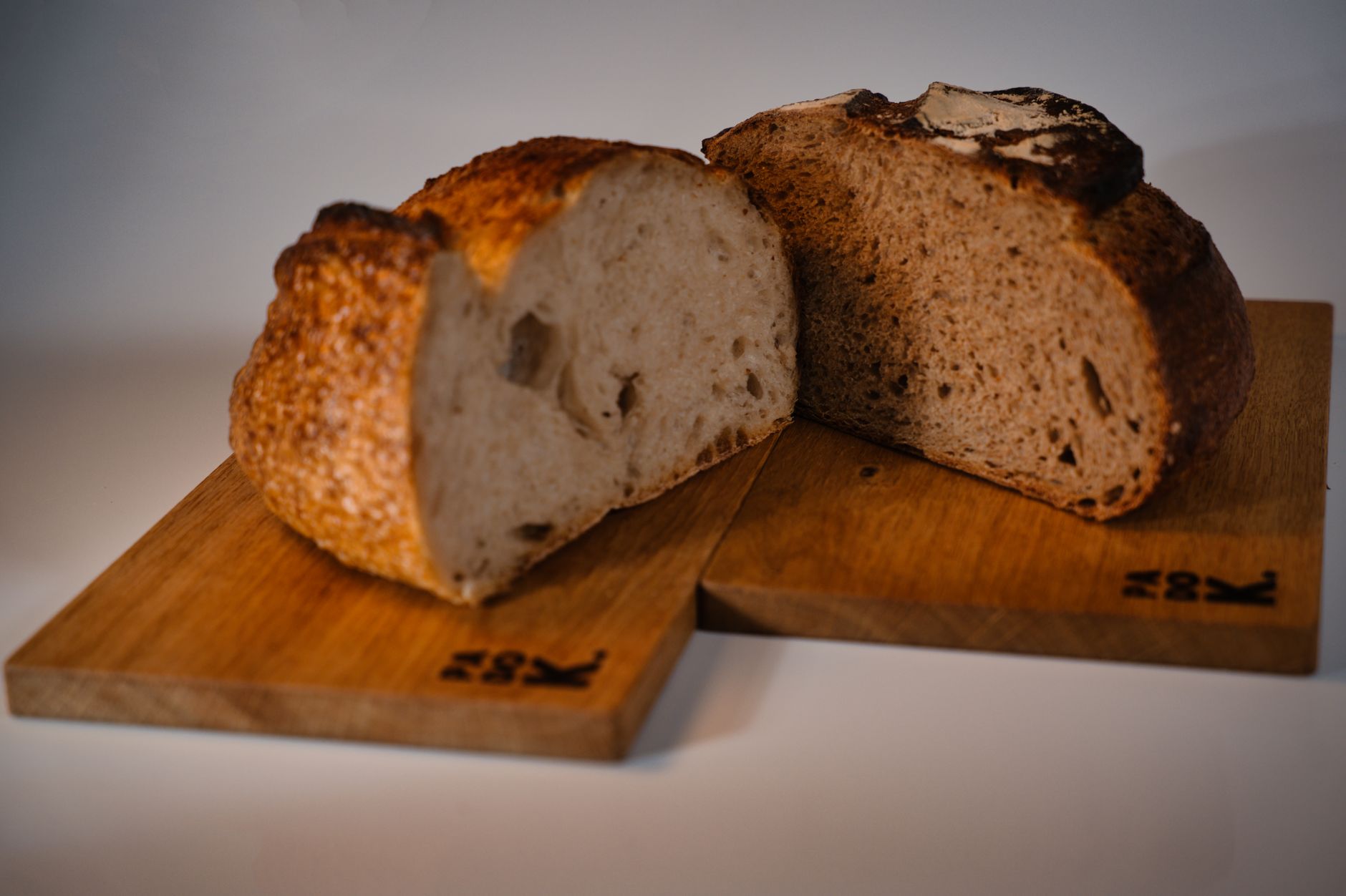 artisan sourdough bread slices on rustic cutting board