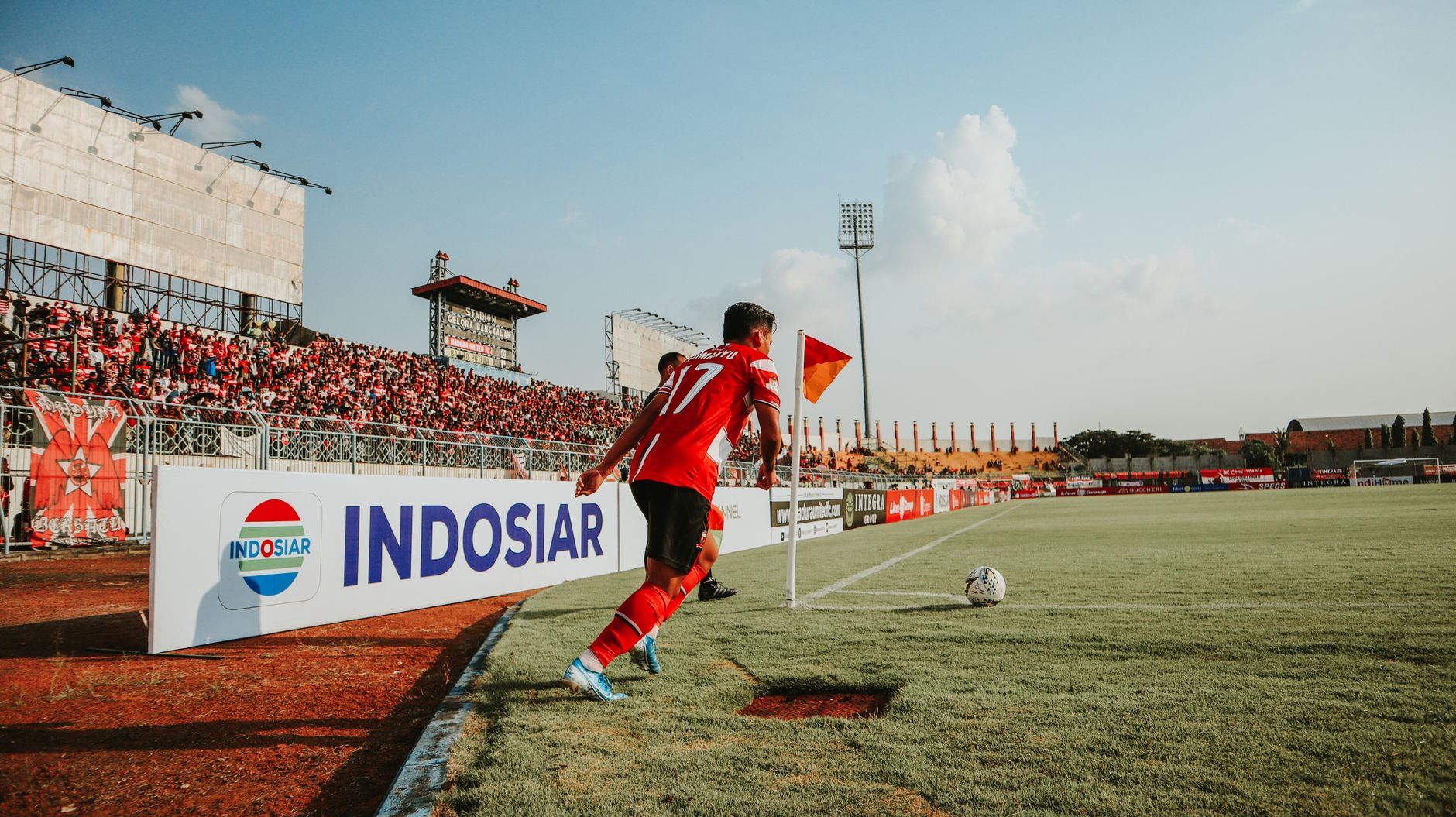 Indonesian football players training on green field