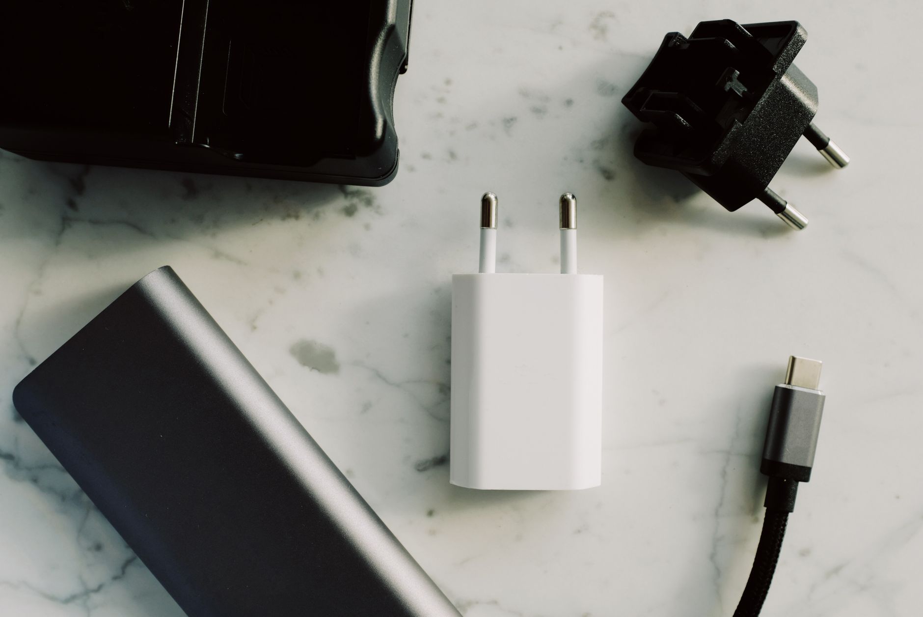 hand connecting smartphone charger to power bank