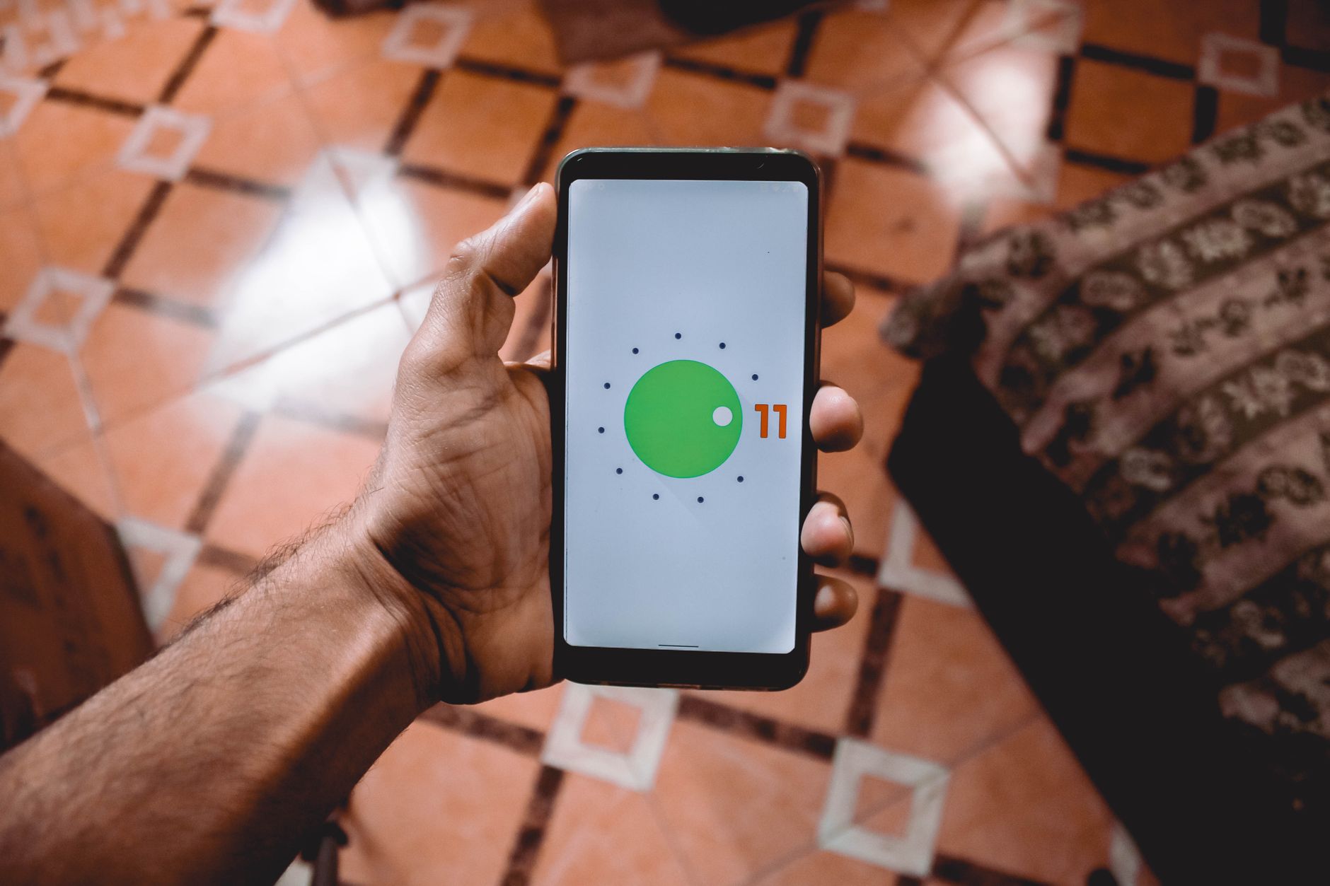 hand holding android phone with bright screen