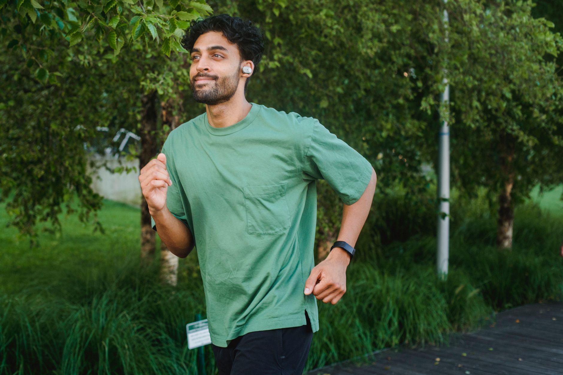 runner checking smartwatch after morning park run