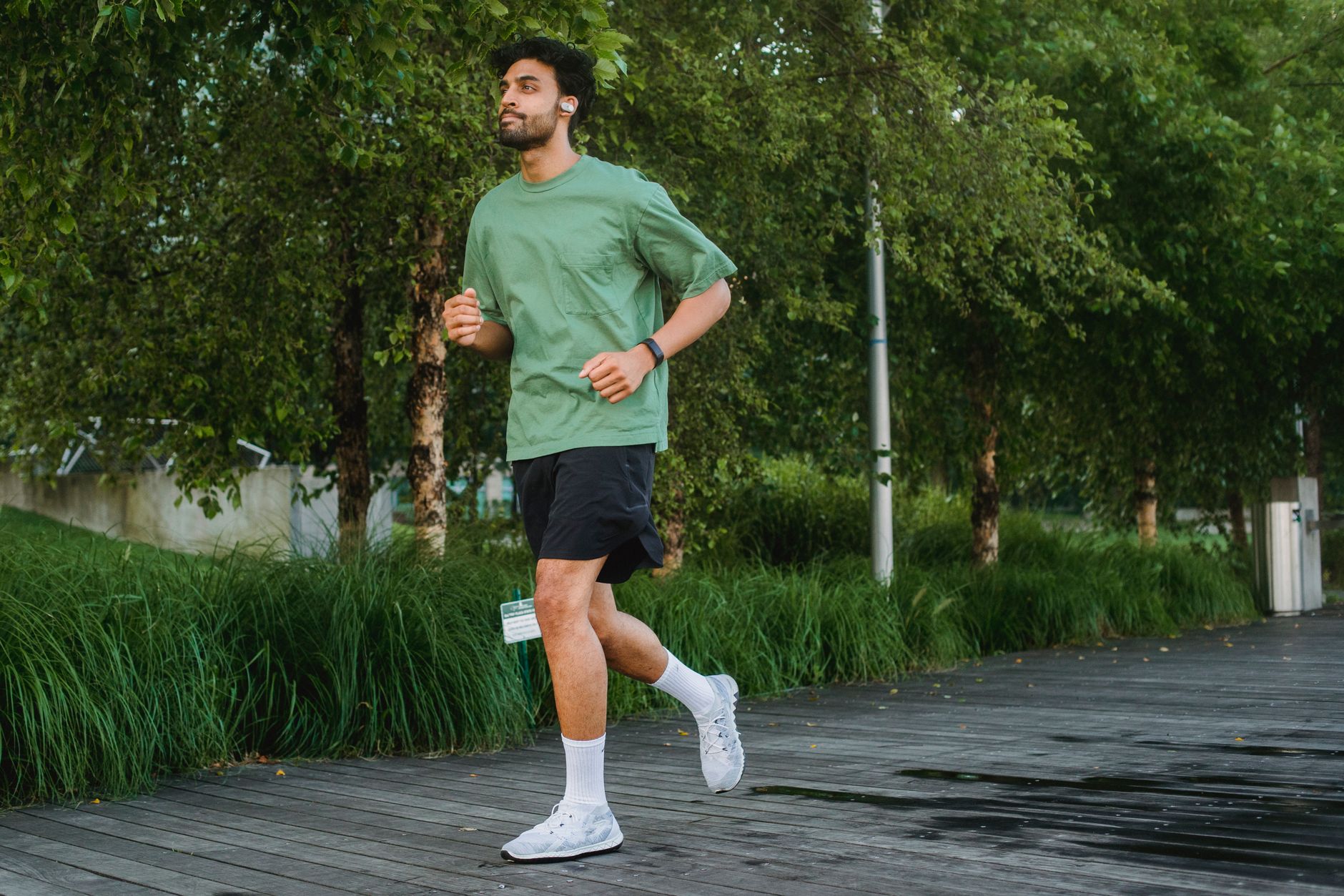 person jogging in green park early morning