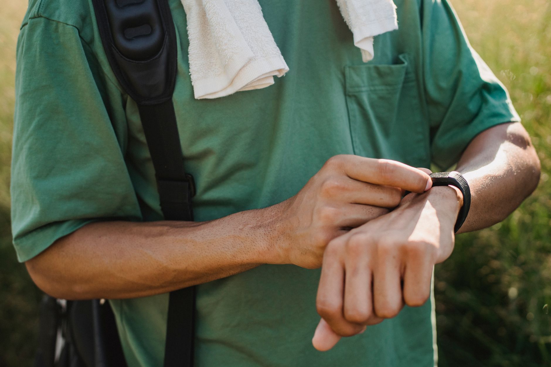runner checking smartwatch activity data