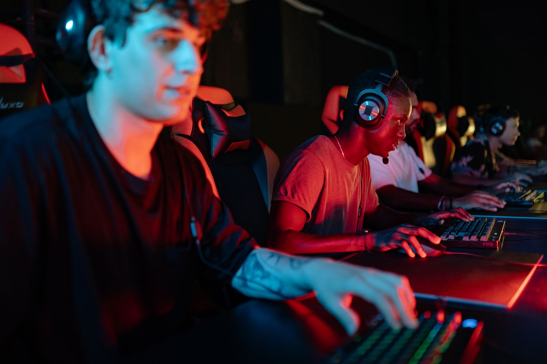 gamer hands on RGB keyboard playing game